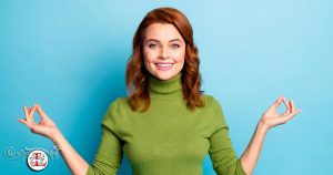 woman in green sweater meditating