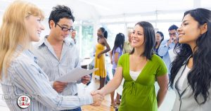 woman shaking hands at work