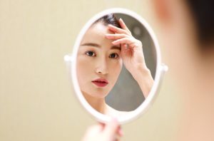 asian women in mirror