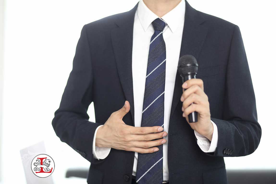 Cropped image of businessman speaking with microphone